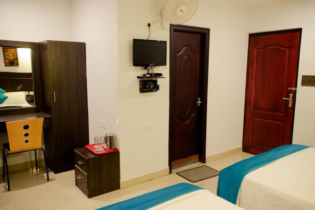 The Signature Inn Бангалор Номер фото